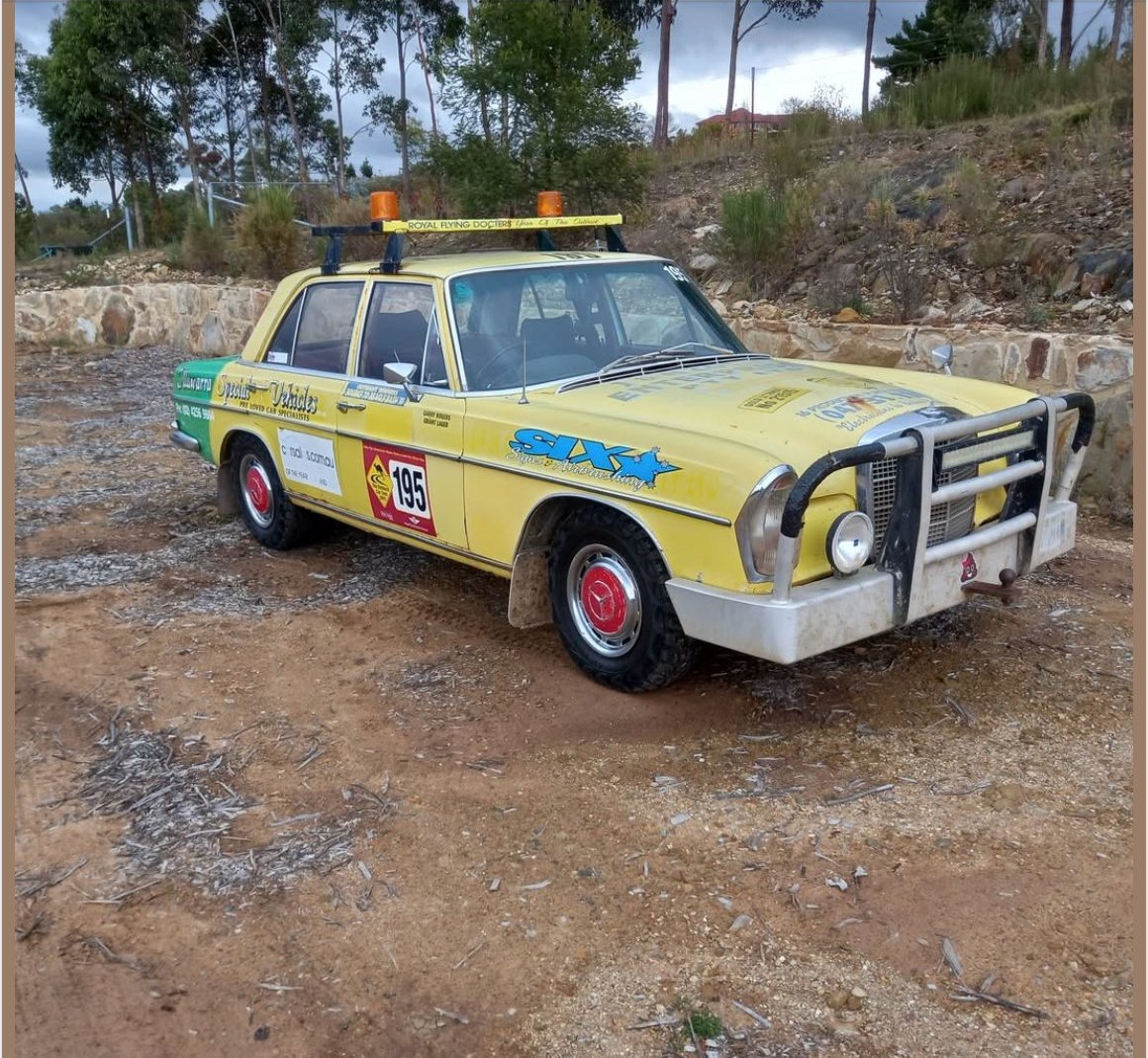 Yellow W108 charity bash car rally with kangaroo bars light bar SIX livery #195
