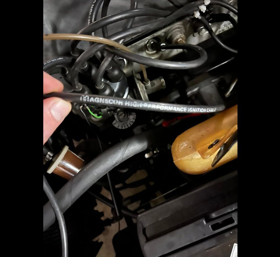 Magnecor high performance ignition cable held next to W108 M130 distributor